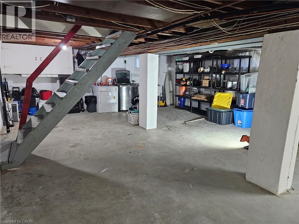 Lower level featuring exposed ceiling joists and a concrete floor - 75 Barons Avenue S, Hamilton, ON - Indoor Photo Showing Basement