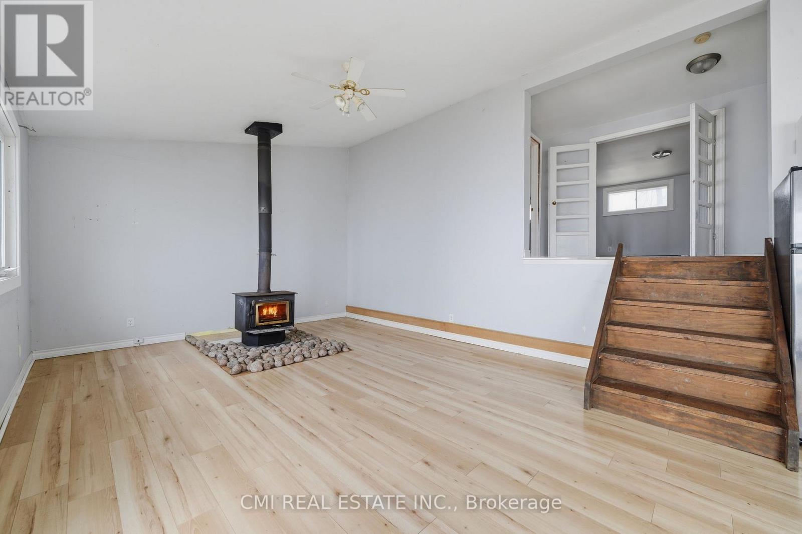 100 Alsops Beach Road, Brock, ON - Indoor Photo Showing Other Room With Fireplace