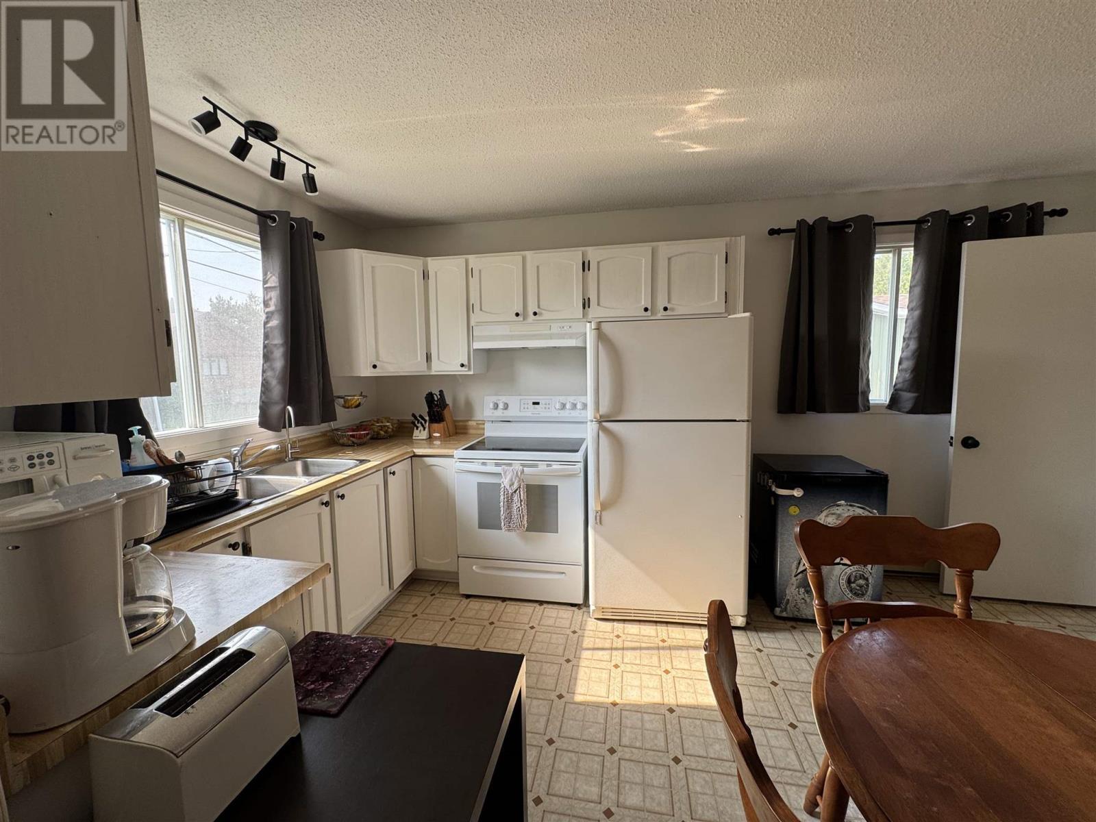 38 Richard St, Chapleau, ON - Indoor Photo Showing Kitchen With Double Sink