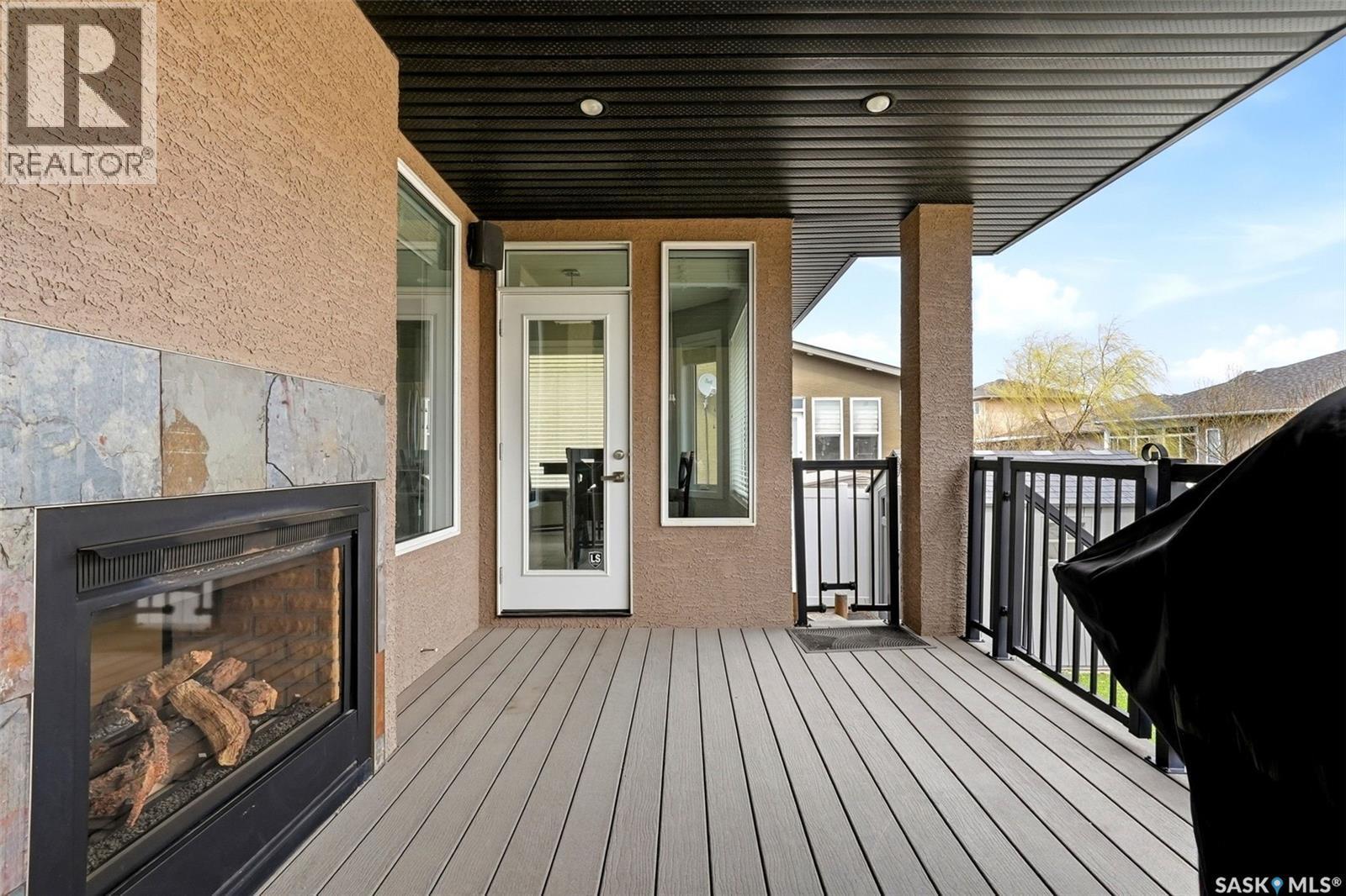 4151 Chuka Drive, Regina, SK - Outdoor With Fireplace With Deck Patio Veranda With Exterior