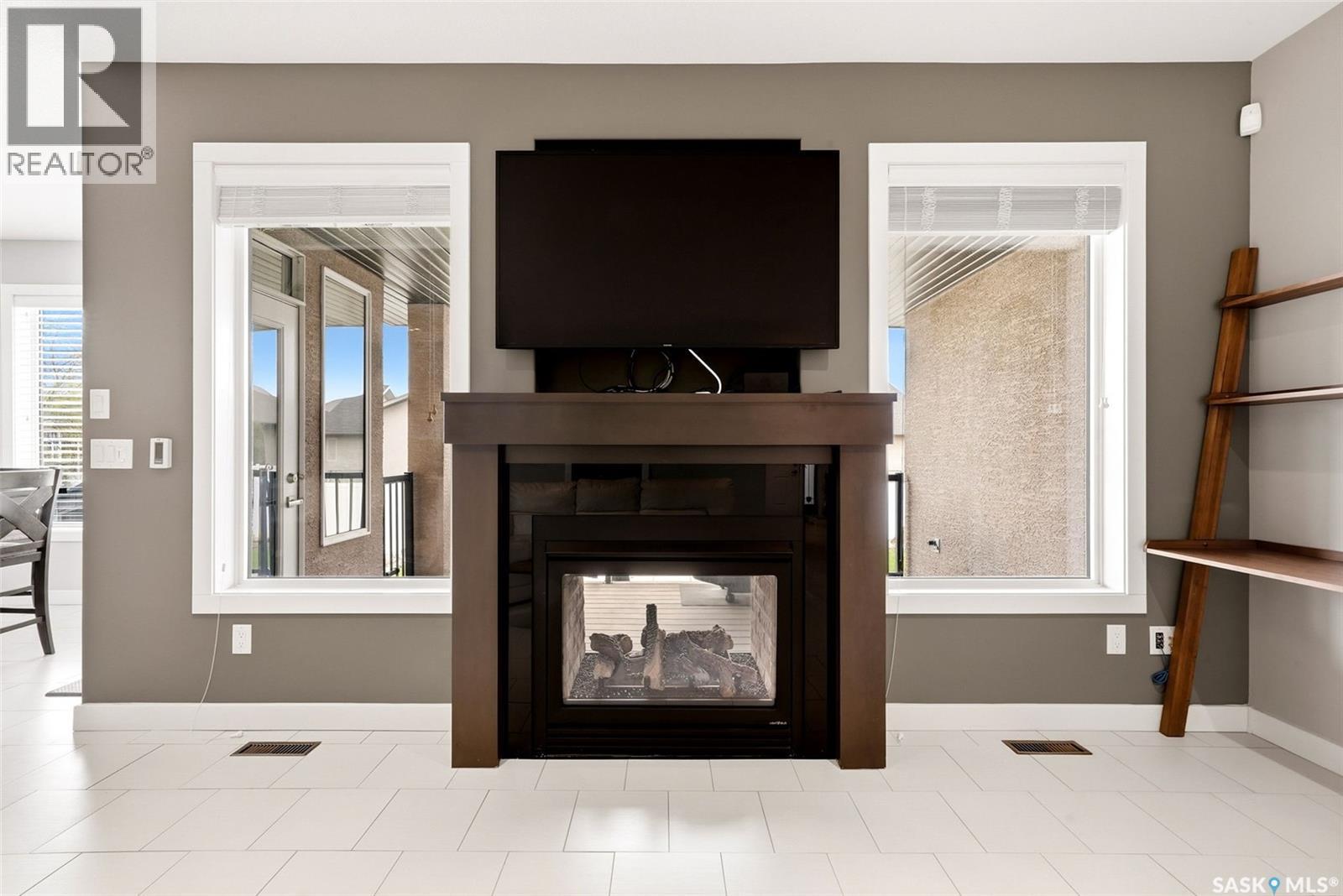 4151 Chuka Drive, Regina, SK - Indoor Photo Showing Living Room With Fireplace