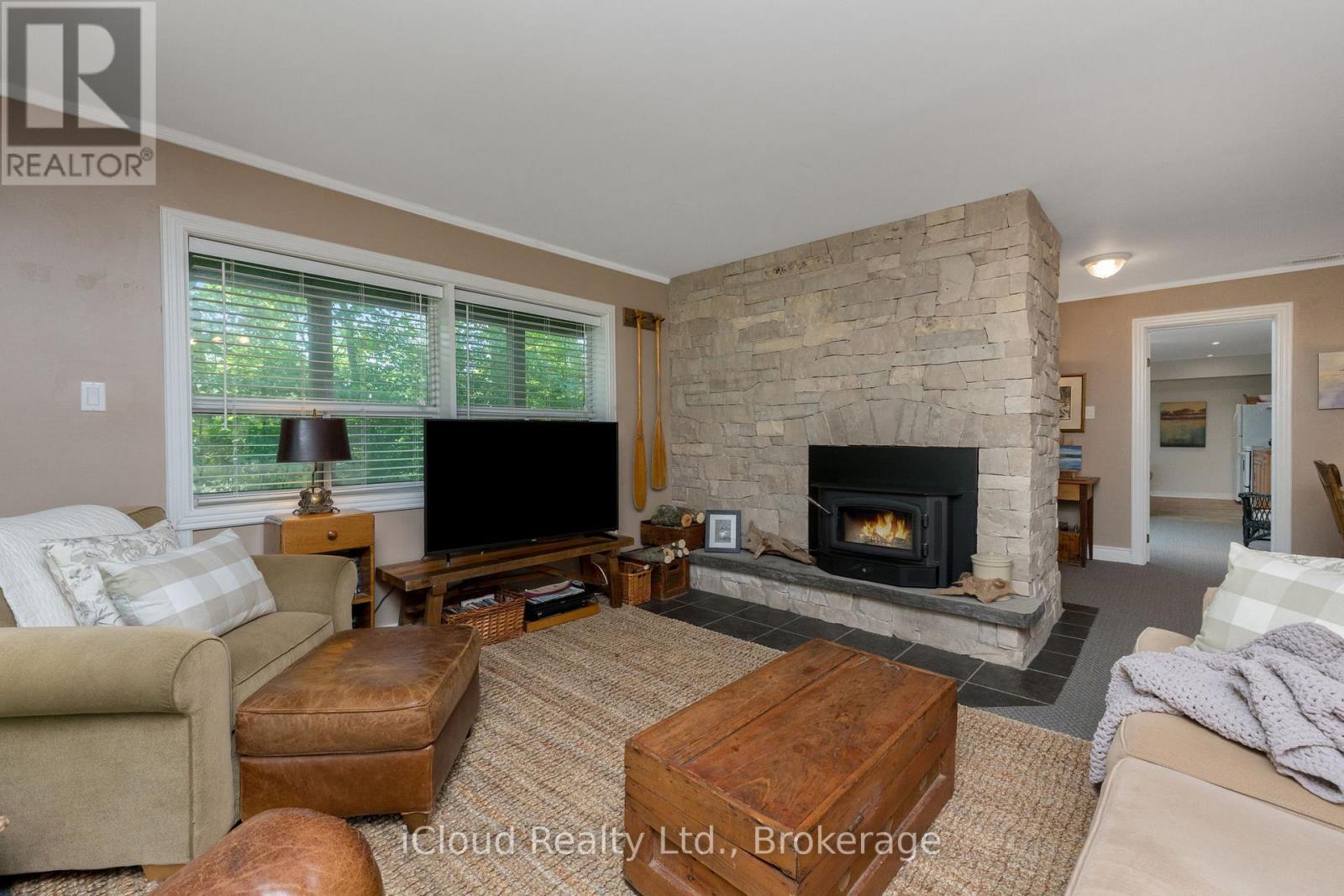 Rec room w/stone fireplace w/insert - 487202 30 Sdrd Side Road, Mono, ON - Indoor Photo Showing Living Room With Fireplace