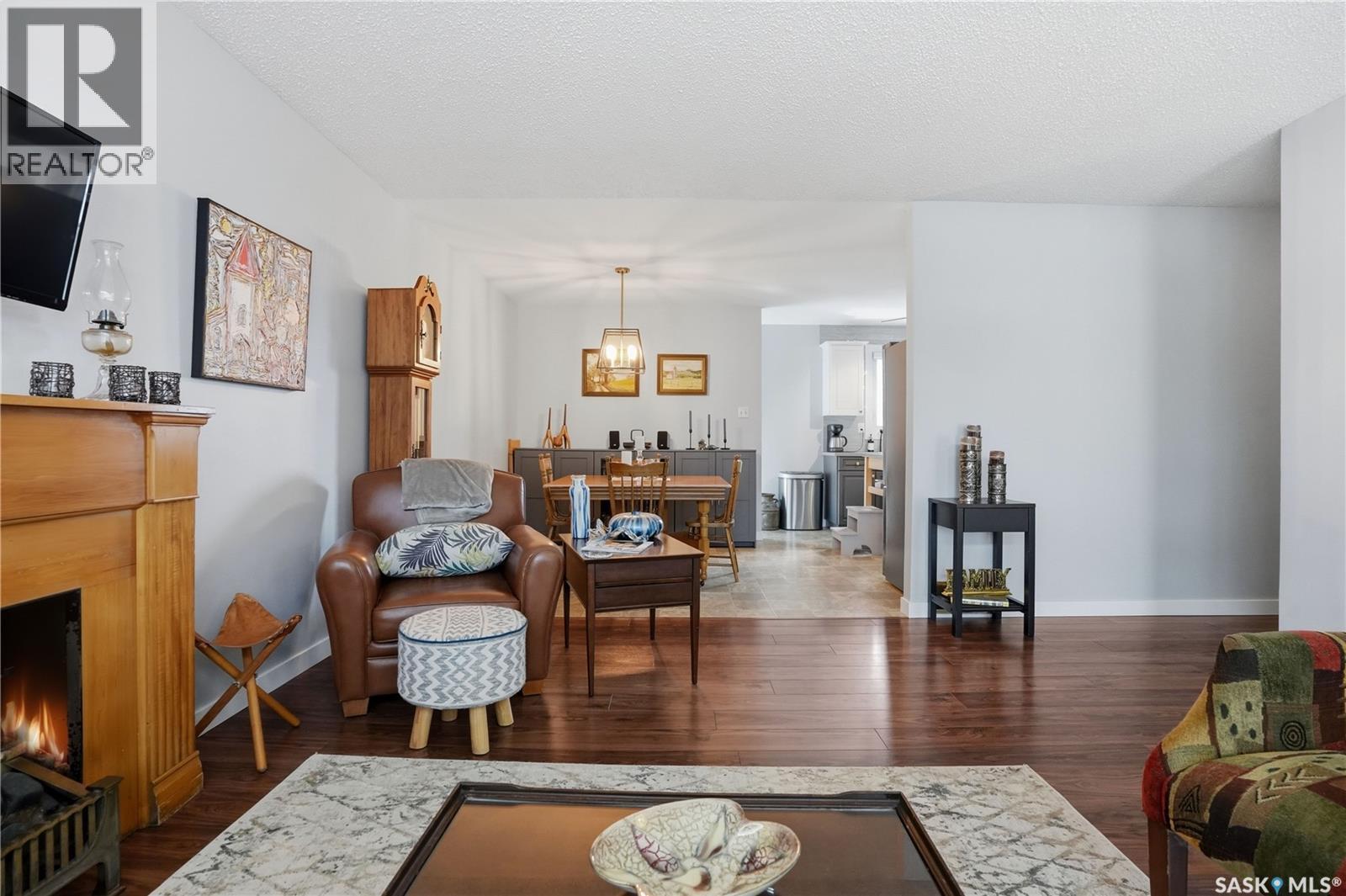 95 Schneider Crescent, Regina, SK - Indoor Photo Showing Living Room With Fireplace