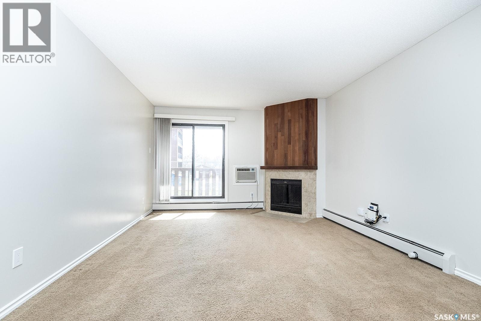 102D2 1121 Mckercher Drive, Saskatoon, SK - Indoor With Fireplace