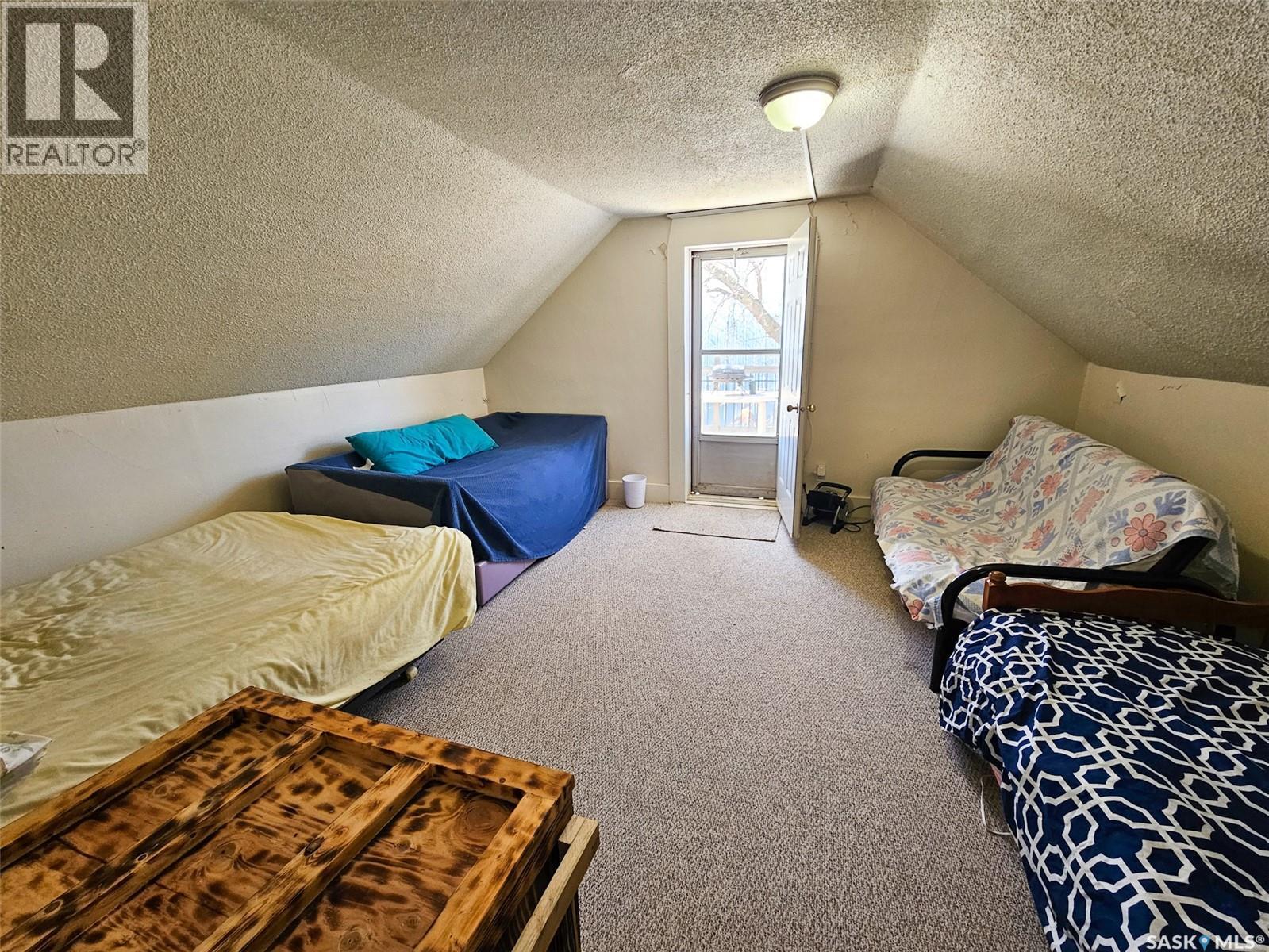 208 Wall Ridge Trail, Lac Pelletier, SK - Indoor Photo Showing Bedroom
