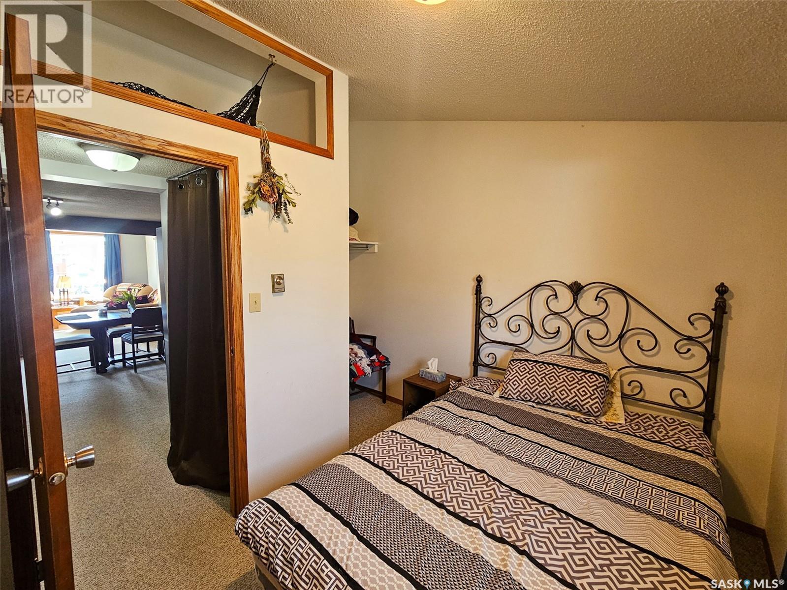 208 Wall Ridge Trail, Lac Pelletier, SK - Indoor Photo Showing Bedroom