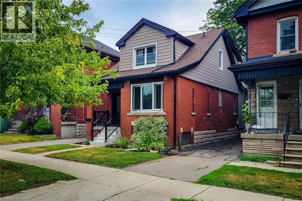 View of front featuring double brick and vinyl siding. - 156 Park Row S, Hamilton, ON - Outdoor