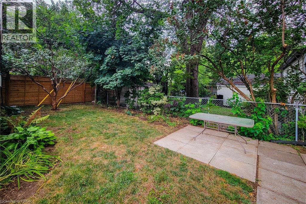 Fenced backyard featuring a patio area - 156 Park Row S, Hamilton, ON - Outdoor