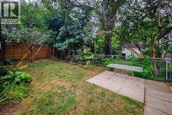 Fenced backyard featuring a patio area -