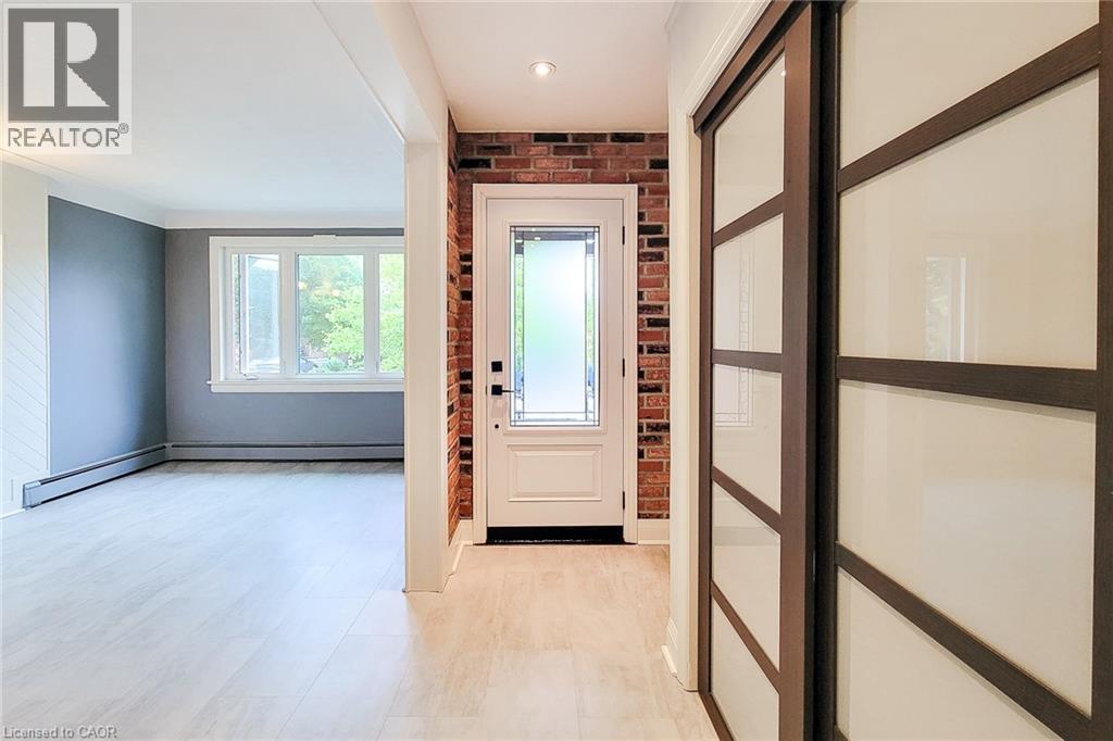 Nice open foyer with modern coat closet. - 156 Park Row S, Hamilton, ON - Indoor Photo Showing Other Room