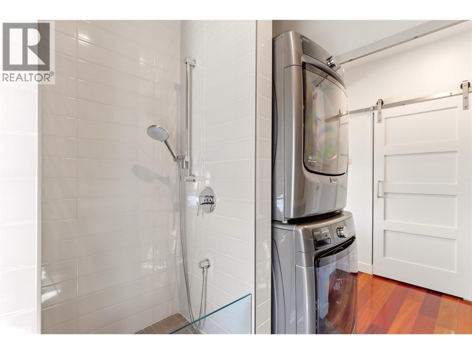 Main floor laundry with a convenient dog wash station - 2090 Bennett Road, Kelowna, BC - Indoor Photo Showing Bathroom