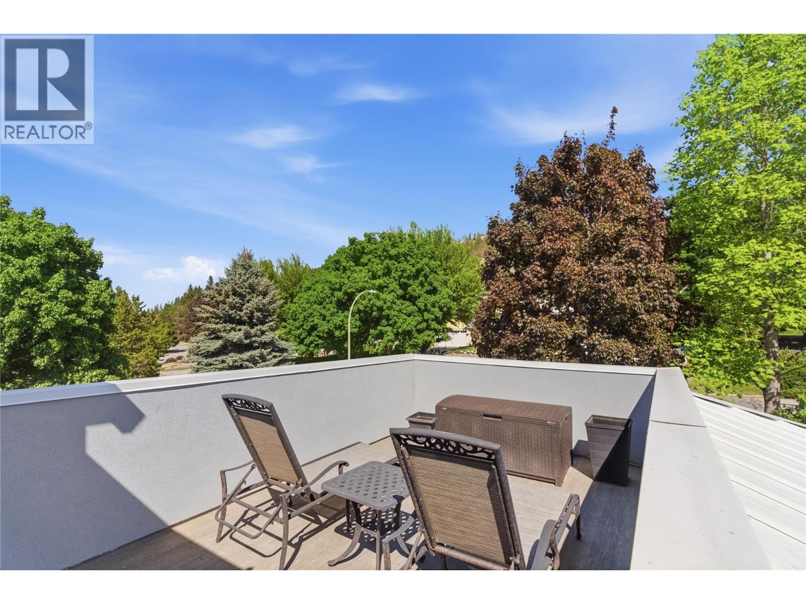 Front sun deck accessed from second level primary bedroom-and stairs that connects to the driveway - 2090 Bennett Road, Kelowna, BC - Outdoor With Deck Patio Veranda