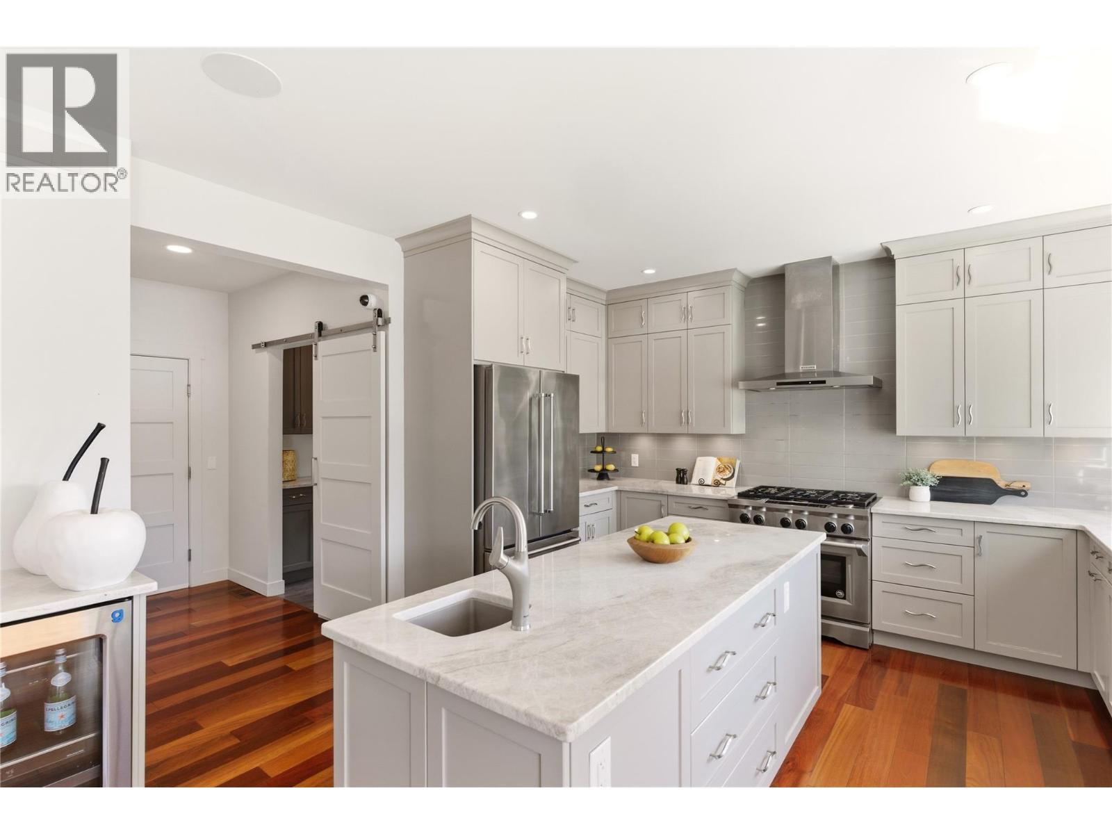 Fully updated kitchen with large windows to take in the lake views - 2090 Bennett Road, Kelowna, BC - Indoor Photo Showing Kitchen With Upgraded Kitchen