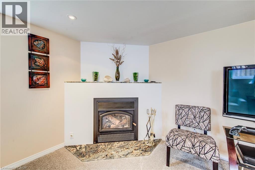 18 Queenston Crescent, Kitchener, ON - Indoor Photo Showing Living Room With Fireplace