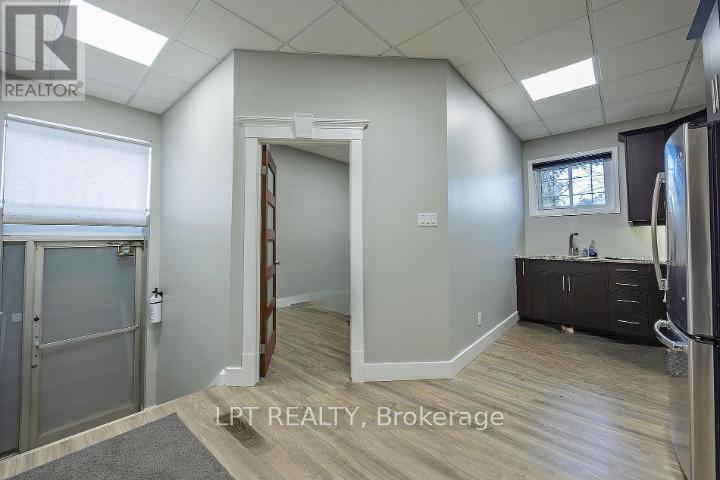 Back exit/looking to bedroom and kitchen area - 215 Wellington Street, London East (East K), ON