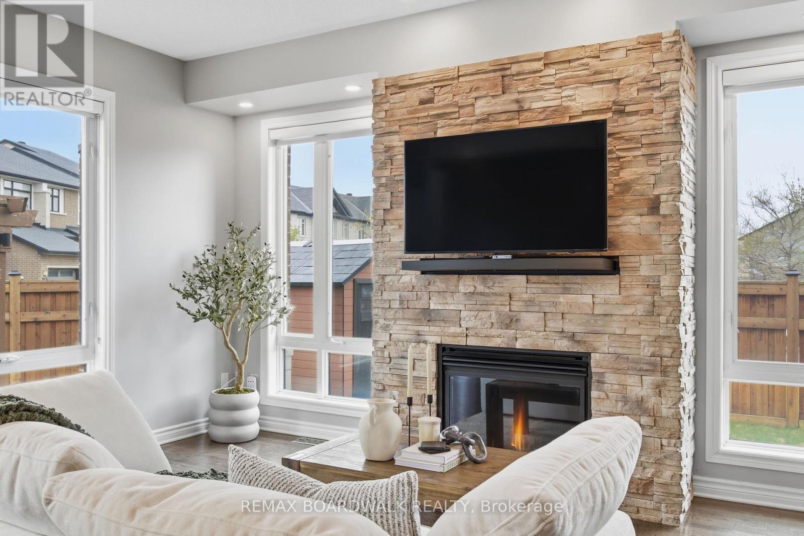 375 Cooks Mill Crescent, Ottawa, ON - Indoor Photo Showing Living Room With Fireplace