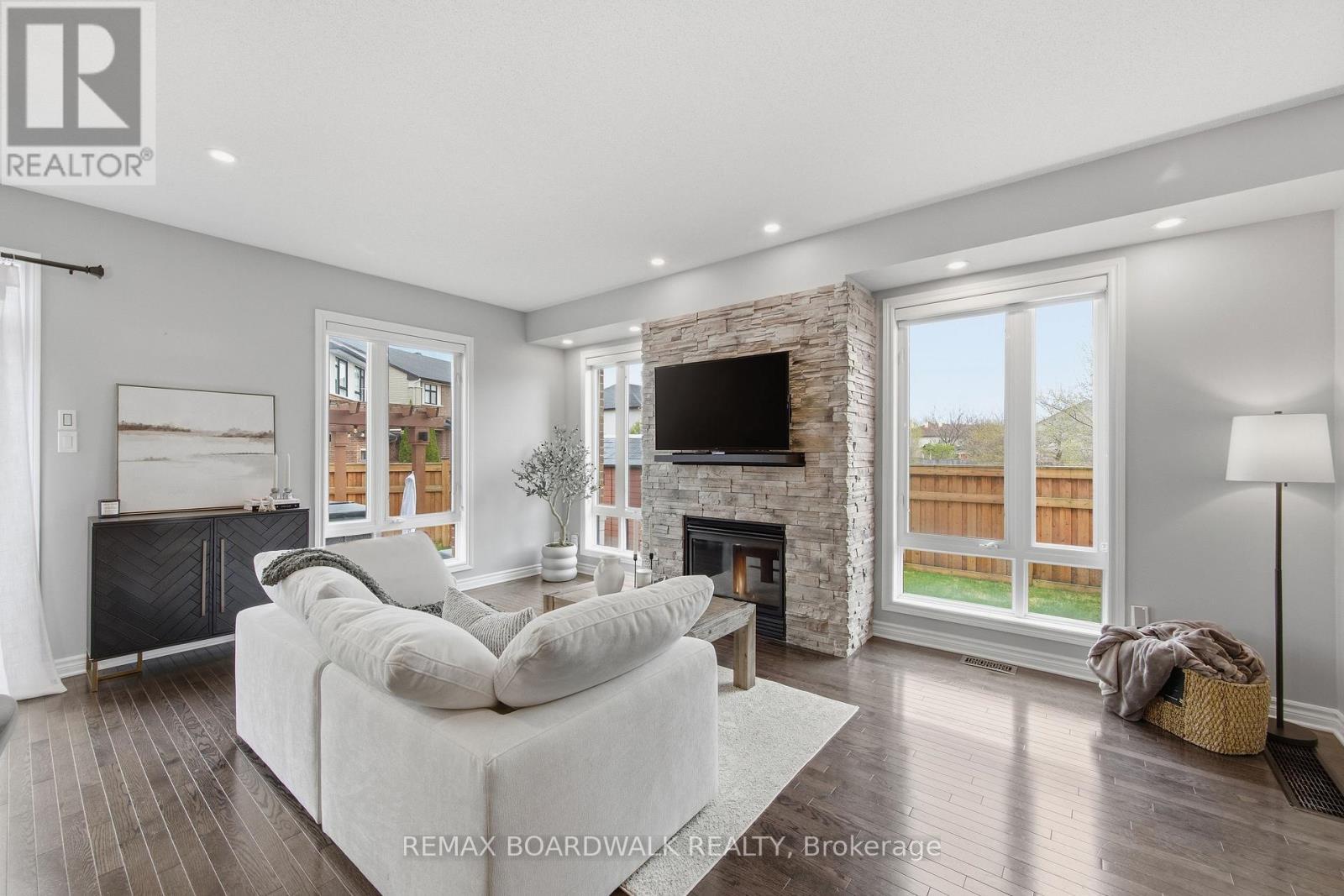 375 Cooks Mill Crescent, Ottawa, ON - Indoor Photo Showing Living Room With Fireplace