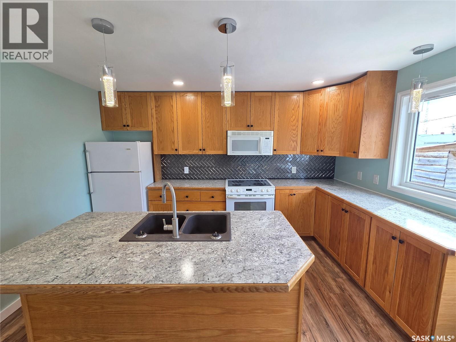 25 Rhodes Street, Redvers, SK - Indoor Photo Showing Kitchen With Double Sink