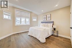 Bedroom featuring sloped ceilings and recessed lighting -