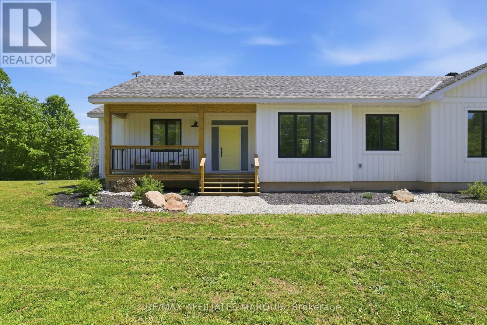 With a front porch made for morning coffee. - 4421M Old Kingston Road, Rideau Lakes, ON