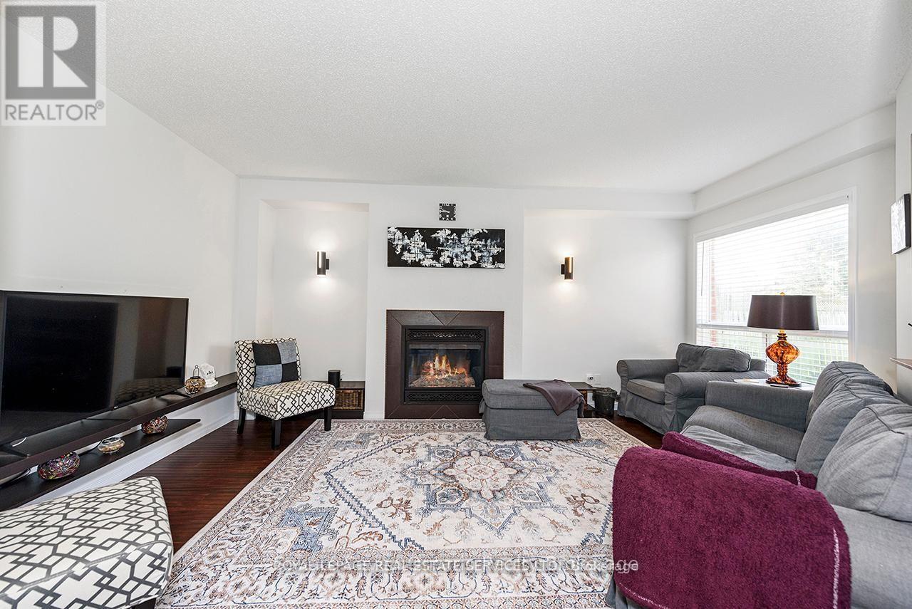 635 Commonwealth Crescent, Kitchener, ON - Indoor Photo Showing Living Room With Fireplace