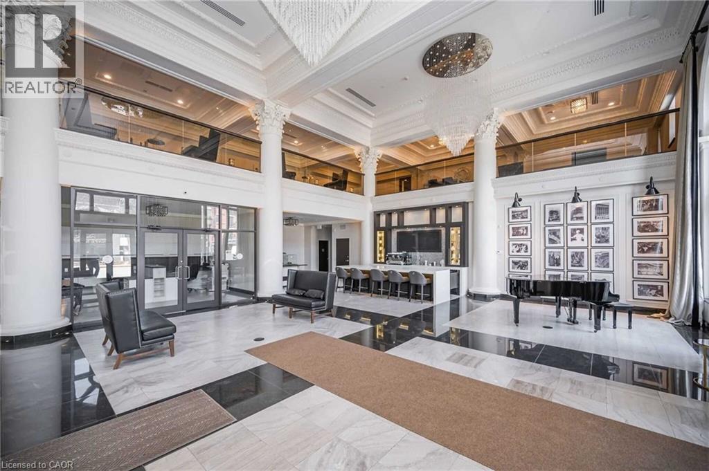 Grand lobby with high ceilings and decorative columns - 112 King Street E Unit# 907, Hamilton, ON