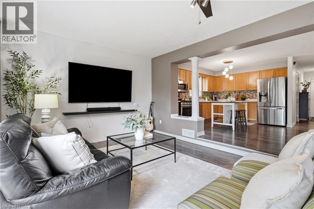 Open-concept living area with dark wood-finish flooring - 128 Houghton Street, Cambridge, ON