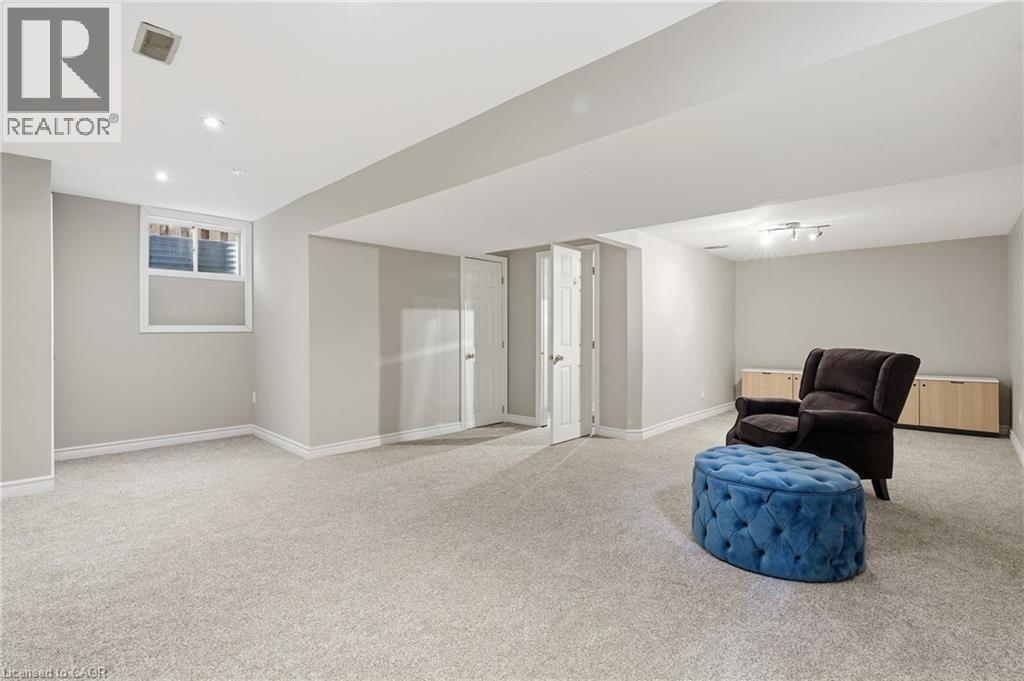 Spacious room featuring light gray carpet flooring and neutral painted walls - 128 Houghton Street, Cambridge, ON
