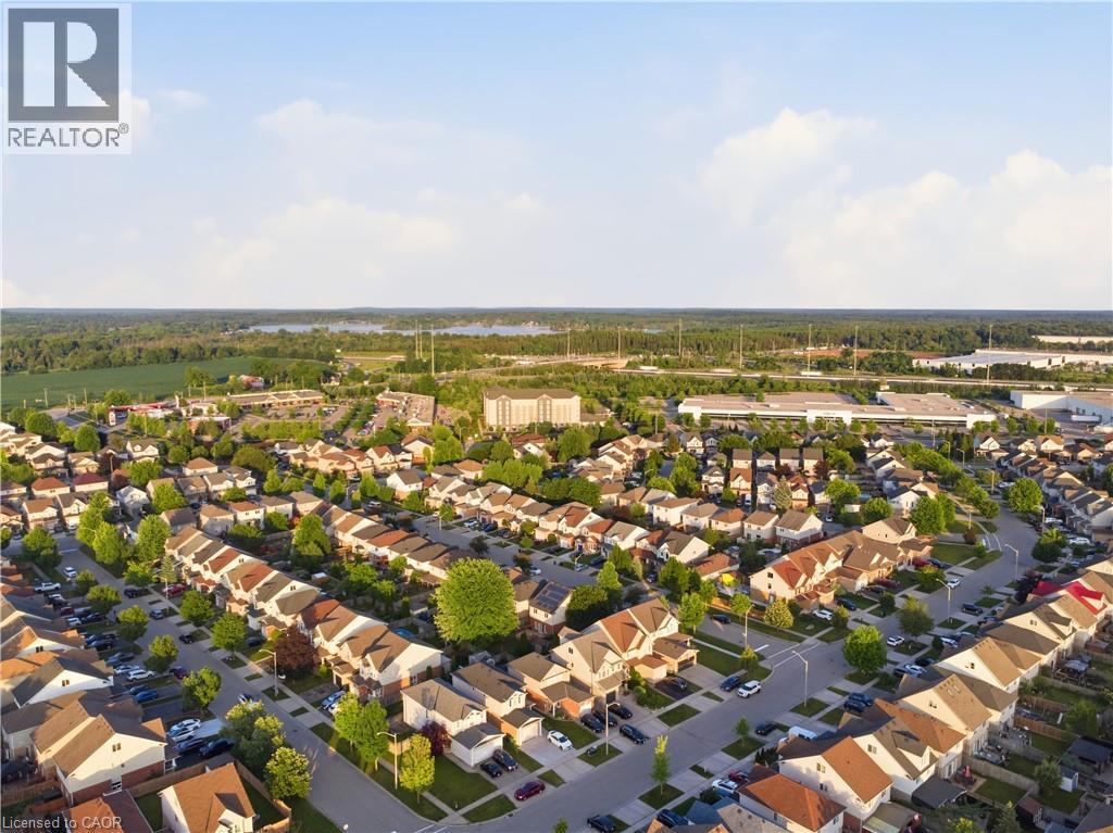 Aerial perspective of a developed residential area featuring a variety of detached and attached homes - 128 Houghton Street, Cambridge, ON