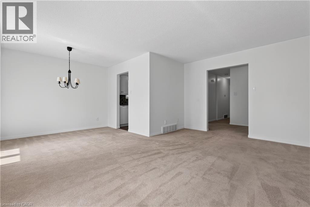 Living Room open to spacious Dining Room - 5051 Brady Avenue, Burlington, ON