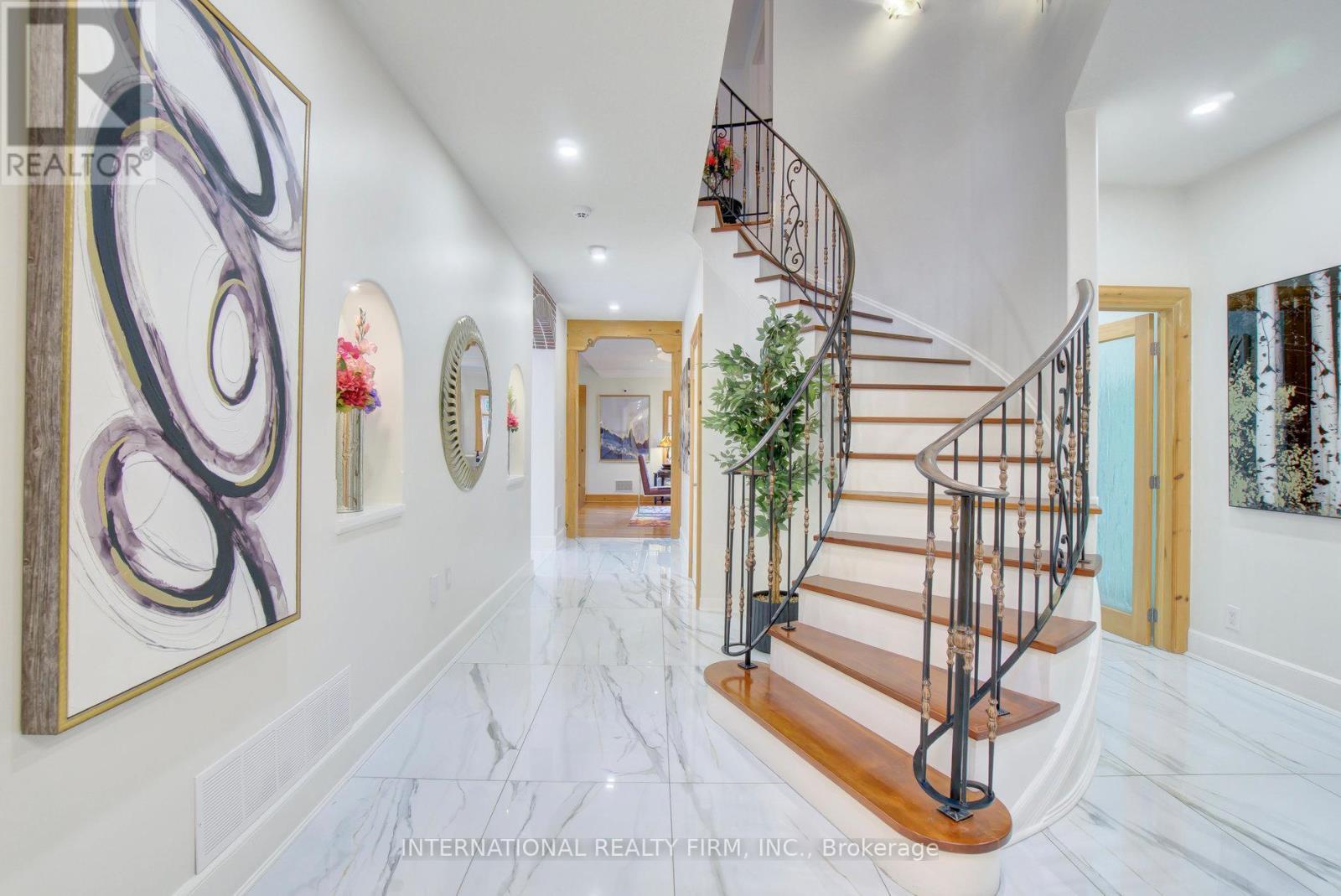 Grand two-storey foyer with porcelain flooring. - 6 Pinehurst Lane, Springwater, ON - Indoor Photo Showing Other Room