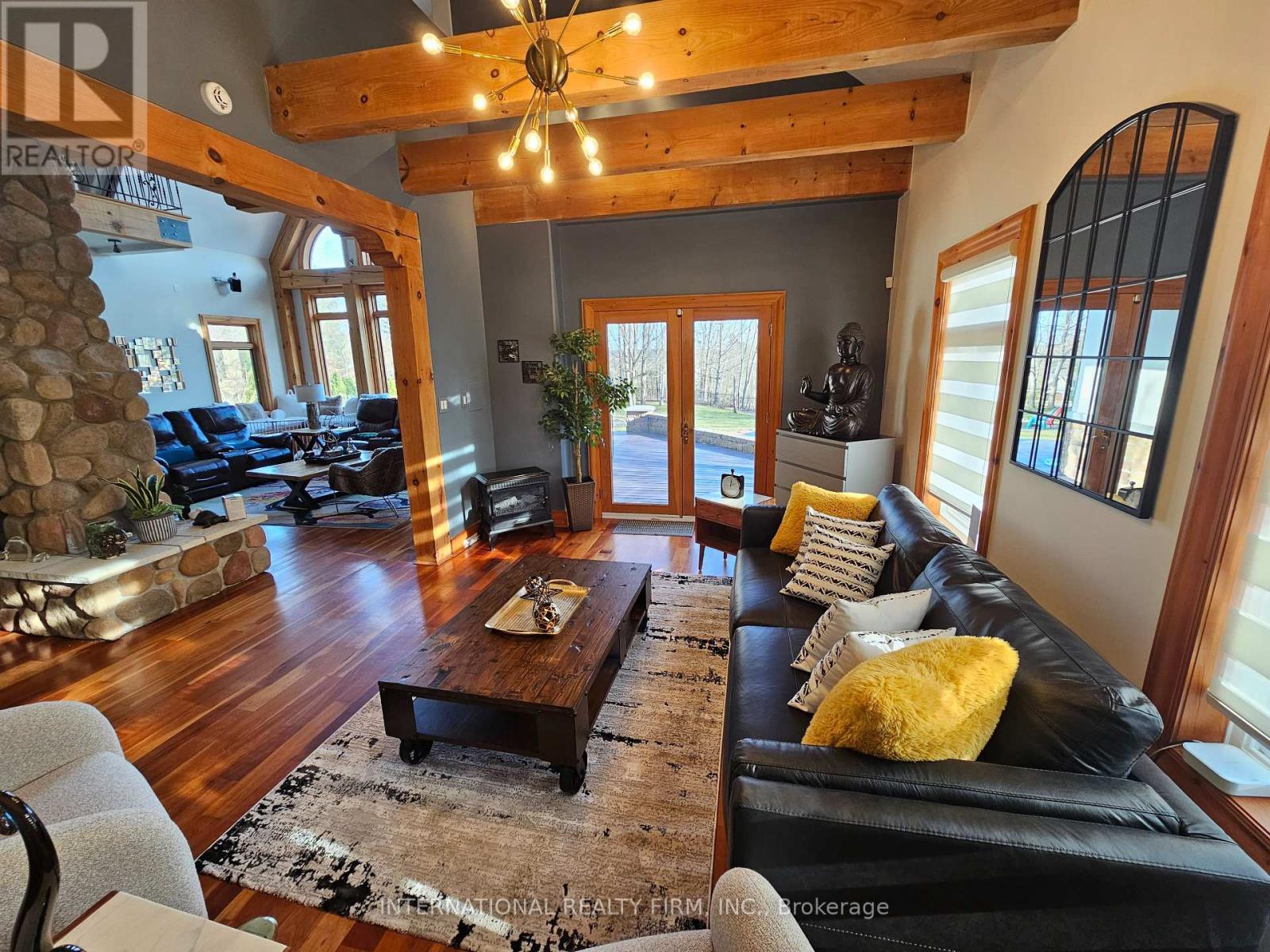 \"Zen-like\" room w/high ceilings & pool walk-out. - 6 Pinehurst Lane, Springwater, ON - Indoor Photo Showing Living Room