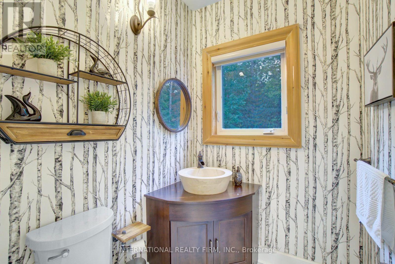 Conveniently located main floor powder room. - 6 Pinehurst Lane, Springwater, ON - Indoor Photo Showing Bathroom