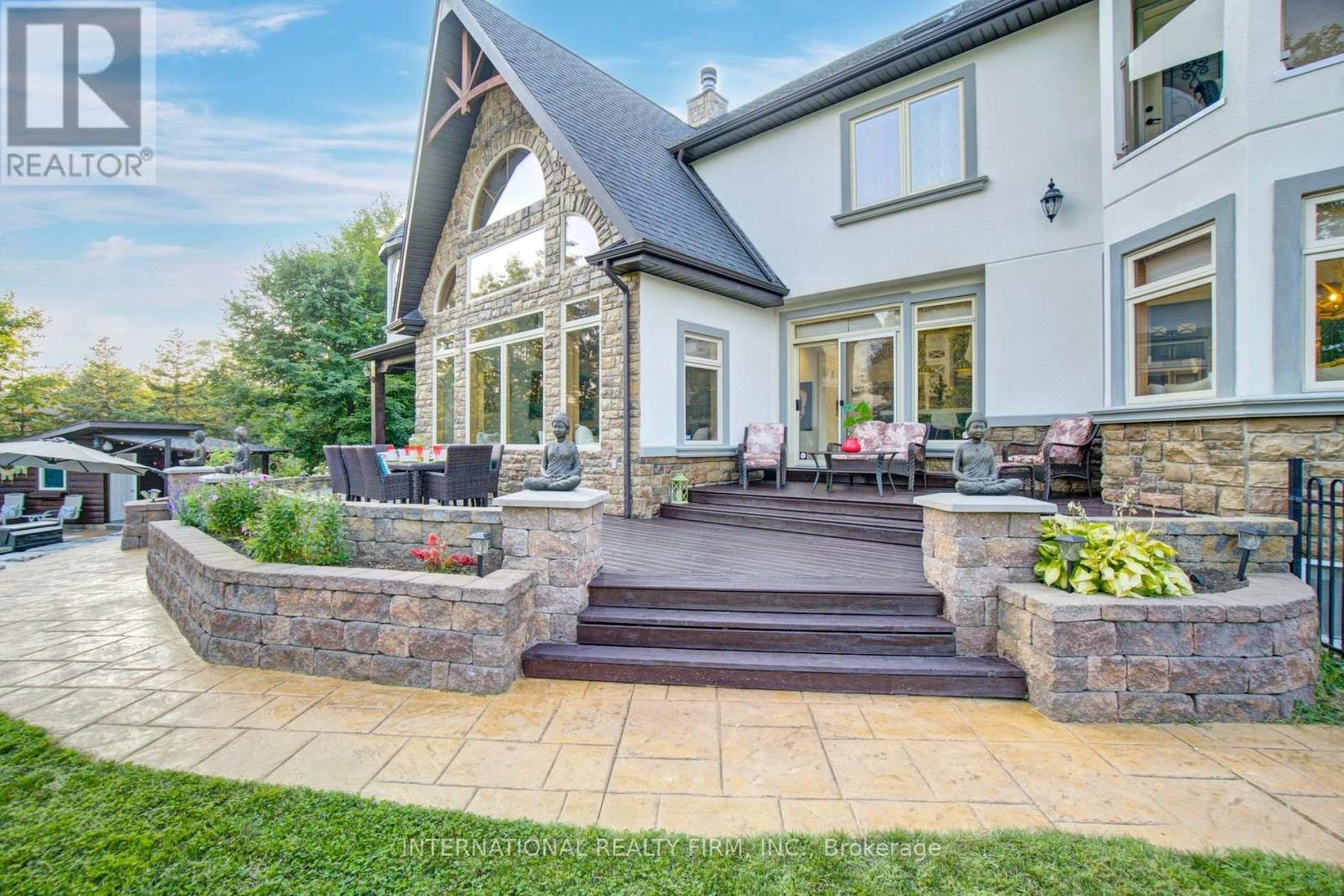 Generous outdoor deck & expansive hosting patio. - 6 Pinehurst Lane, Springwater, ON - Outdoor With Deck Patio Veranda