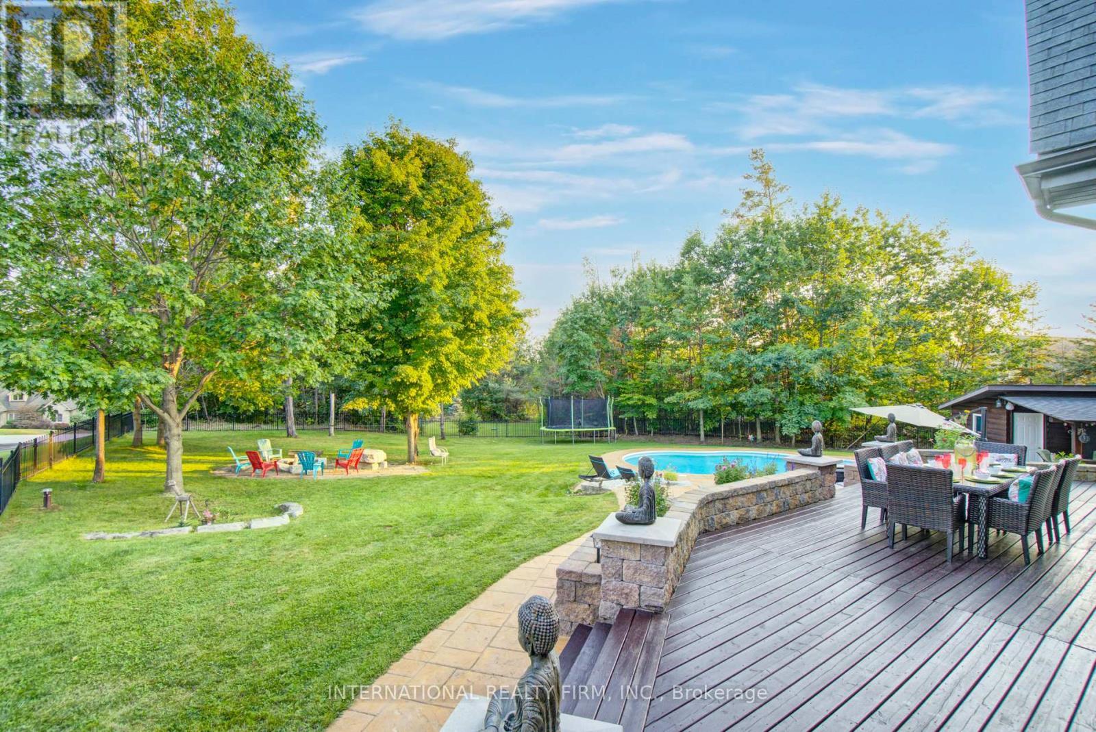 Manicured estate grounds framed by mature trees. - 6 Pinehurst Lane, Springwater, ON - Outdoor
