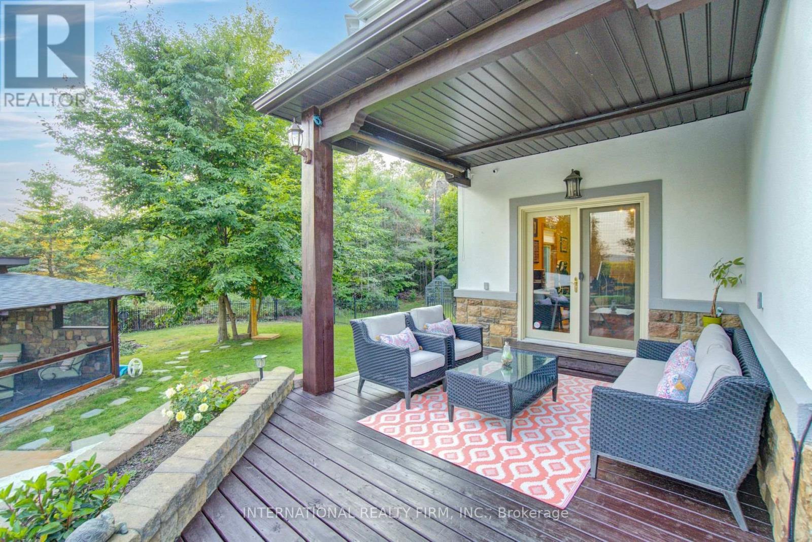 Covered porch lounge area overlooking pool retreat - 6 Pinehurst Lane, Springwater, ON - Outdoor With Deck Patio Veranda With Exterior