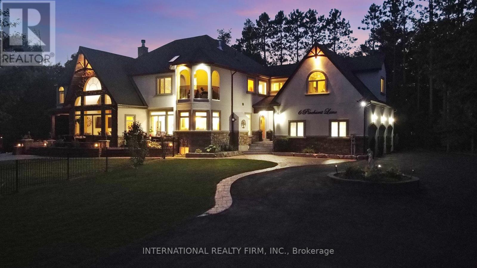 Magical curb appeal highlights the estate. - 6 Pinehurst Lane, Springwater, ON - Outdoor With Facade
