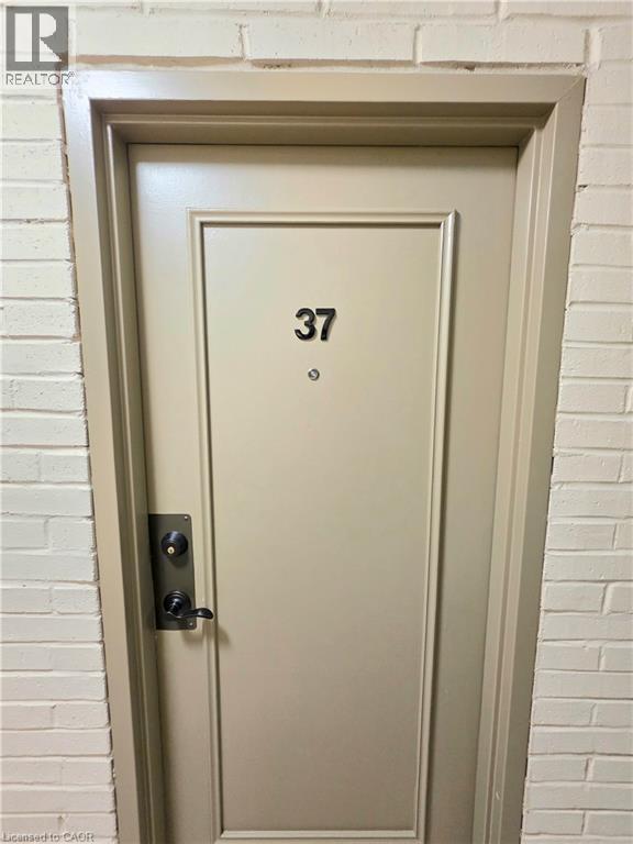 Panel-style door with dark hardware - 2373 E King Street E Unit# 37, Hamilton, ON