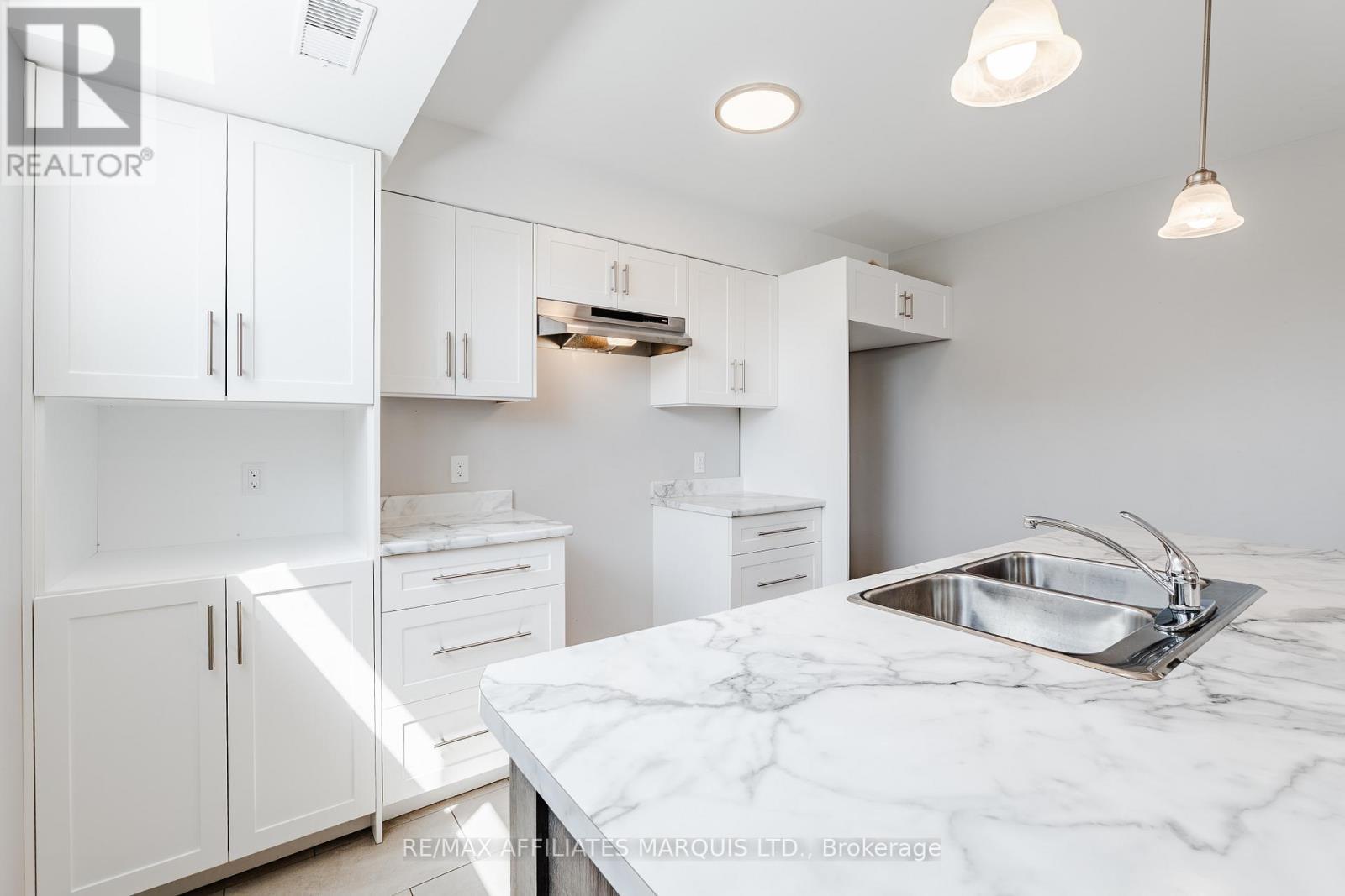 Photo is of lower unit - 2459 Watson Crescent, Cornwall, ON
