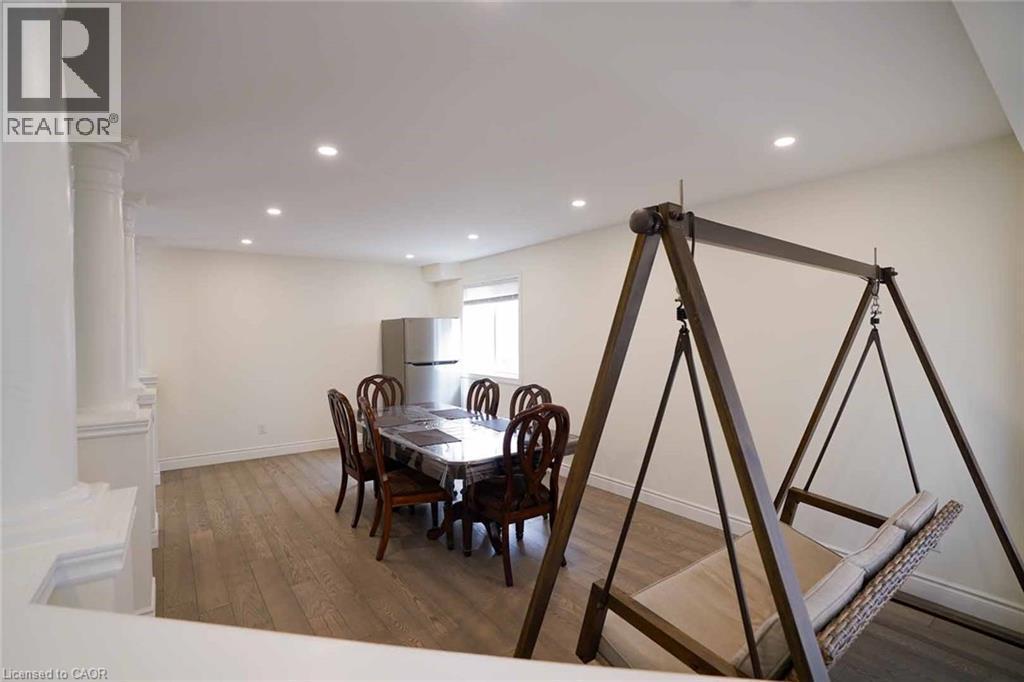 Spacious interior featuring wood-finish flooring and recessed lighting - 187 Adler Drive, Cambridge, ON - Indoor Photo Showing Dining Room