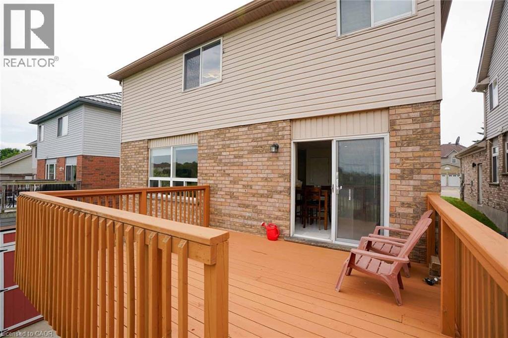 Expansive wood deck with a natural wood finish, featuring a full railing system - 187 Adler Drive, Cambridge, ON - Outdoor With Deck Patio Veranda With Exterior