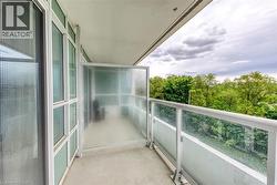 Private balcony with a concrete surface and a clear glass railing - 