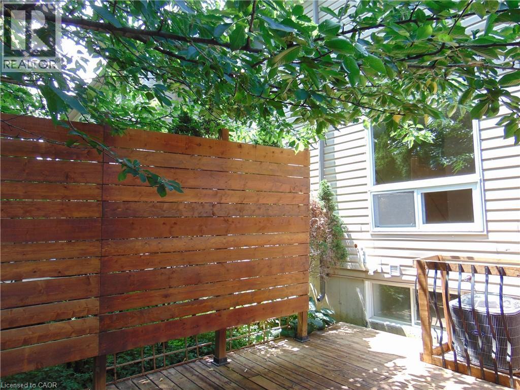 Wood privacy fence with horizontal slats - 214 Snowdrop Crescent, Kitchener, ON
