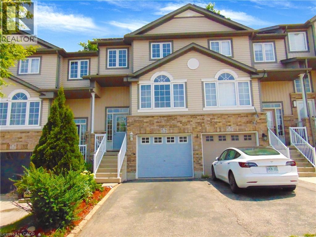 Multi-level townhome featuring a solid brick and siding facade - 214 Snowdrop Crescent, Kitchener, ON - Outdoor With Facade