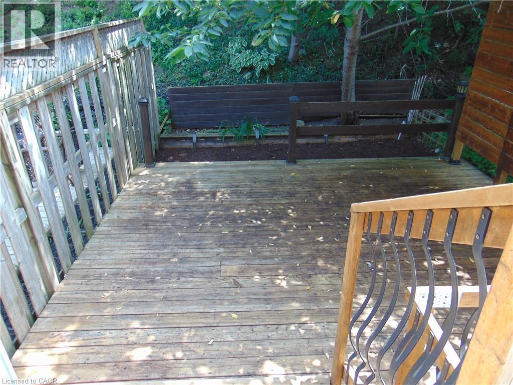 Spacious outdoor wood deck with a privacy fence - 214 Snowdrop Crescent, Kitchener, ON