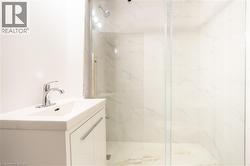 White vanity with an integrated sink and chrome faucet -