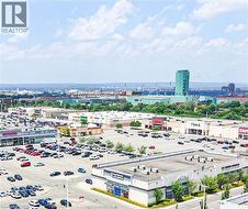 Urban landscape featuring diverse commercial buildings with extensive parking areas -