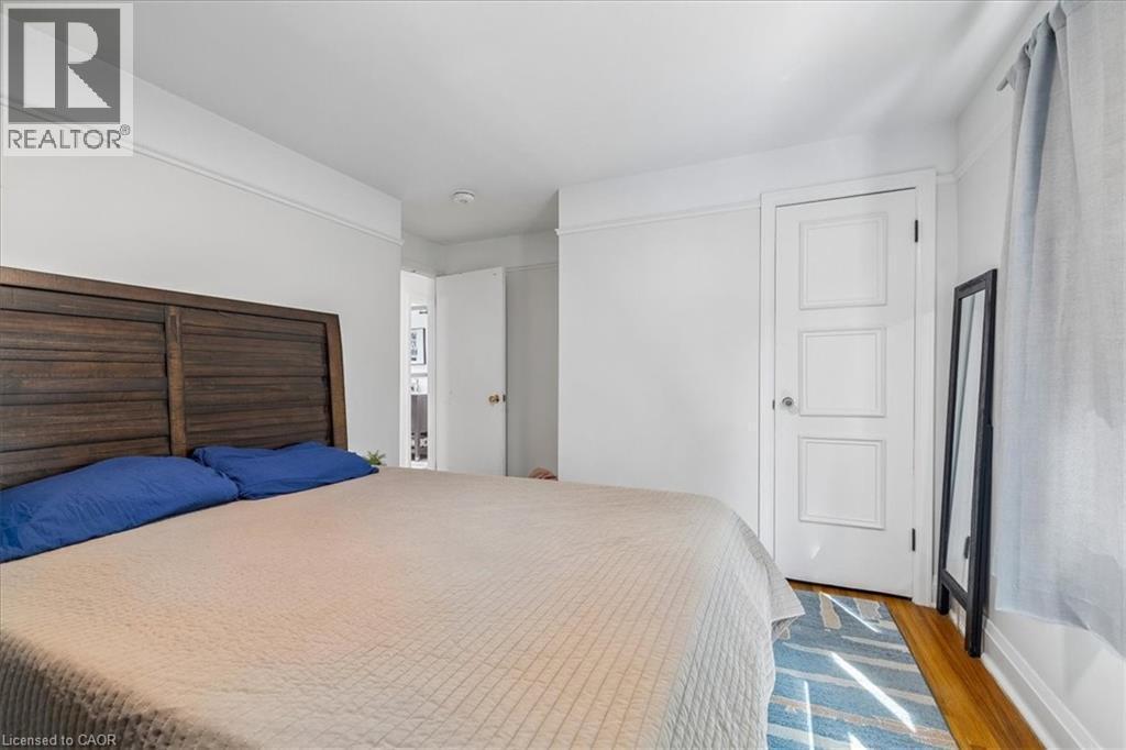Room featuring wood-finish flooring and white painted walls with crown molding - 80 Maclennan Avenue, Hamilton, ON - Indoor Photo Showing Bedroom