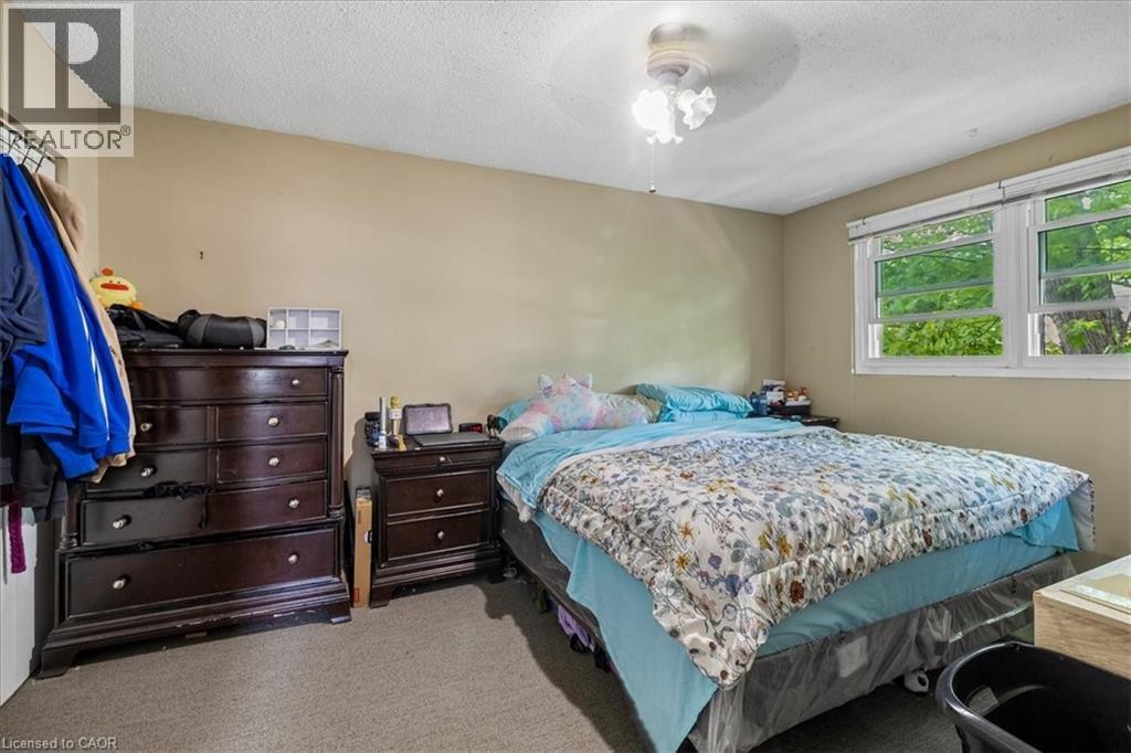 Room with neutral-toned walls, textured ceiling, and carpeted flooring - 80 Maclennan Avenue, Hamilton, ON