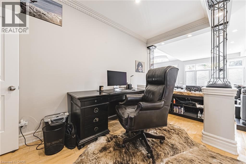 Dedicated office space featuring light wood-finish flooring and crown molding - 712 Highvalley Road, Ancaster, ON